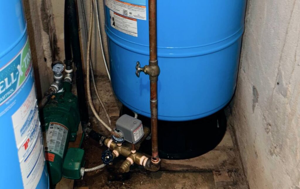 Brass fittings on tank for Well pump repair local by Superior Plumbing & Heating.