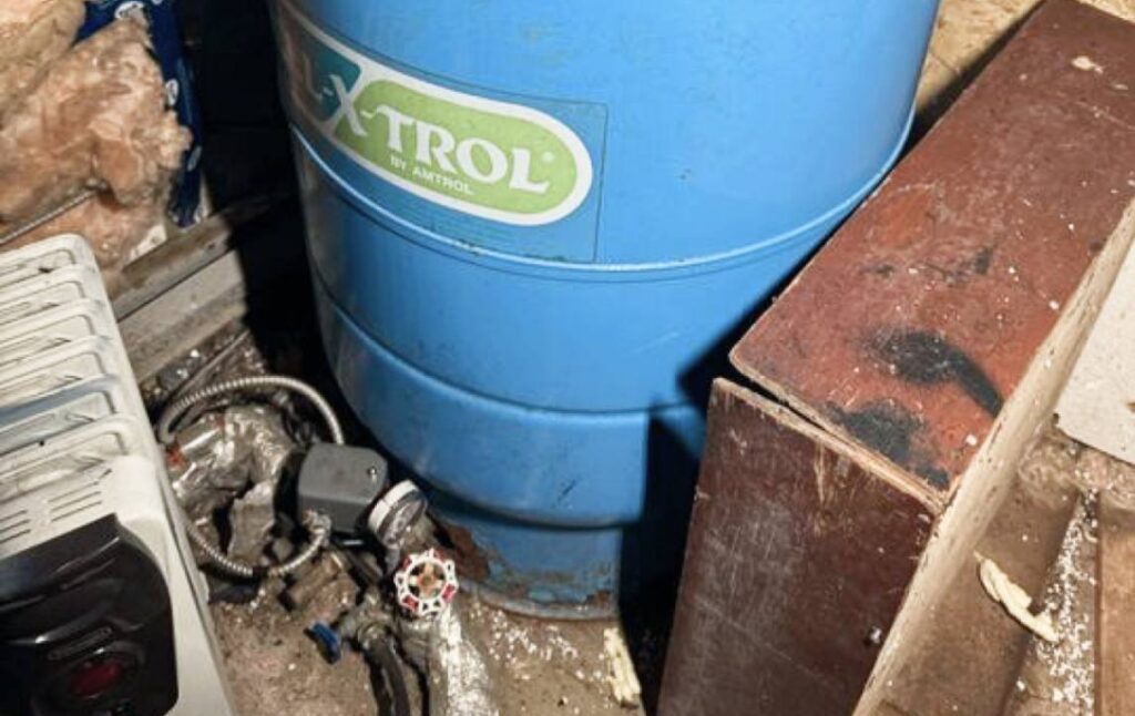 Extrol blue tank check during Well pump repair local by Superior Plumbing & Heating