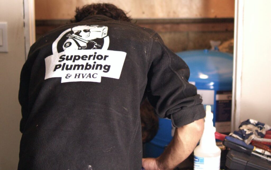 Specialist from Superior Plumbing & Heating performing a well pump repair local.