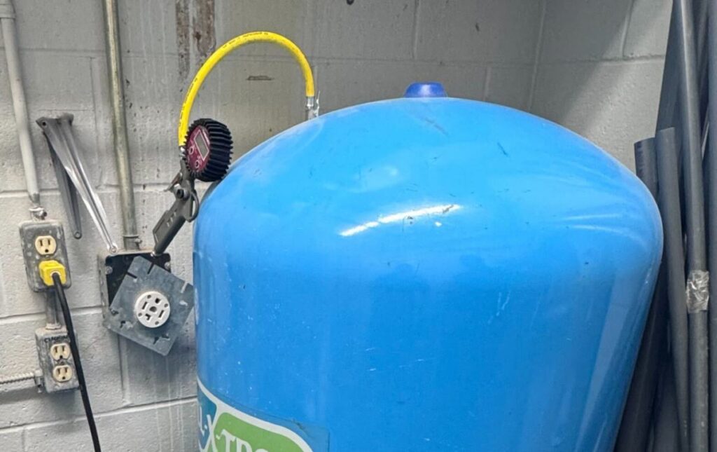 Testing the pressure tank and yellow flex line for a well pump replacement local by Superior Plumbing & Heating