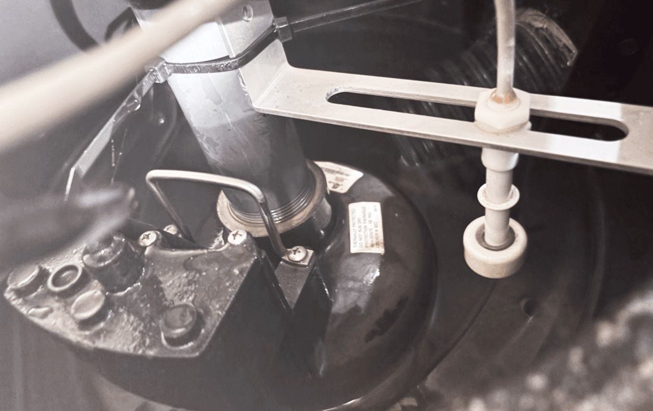 Precision pump mounting during a sump-pump-replacement local project by Superior Plumbing & Heating.