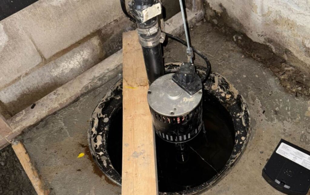 Submersible unit tested in a pit after Sump pump replacement local by Superior Plumbing & Heating.