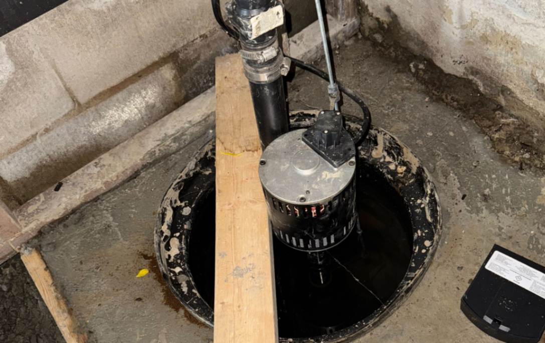 Submersible unit tested in a pit after Sump pump replacement local by Superior Plumbing & Heating.