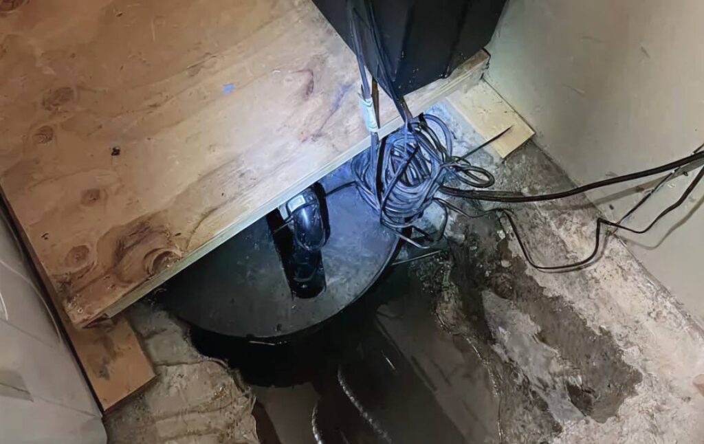 Superior Plumbing & Heating diagnosing a dark basement pit for sump pump repair local.