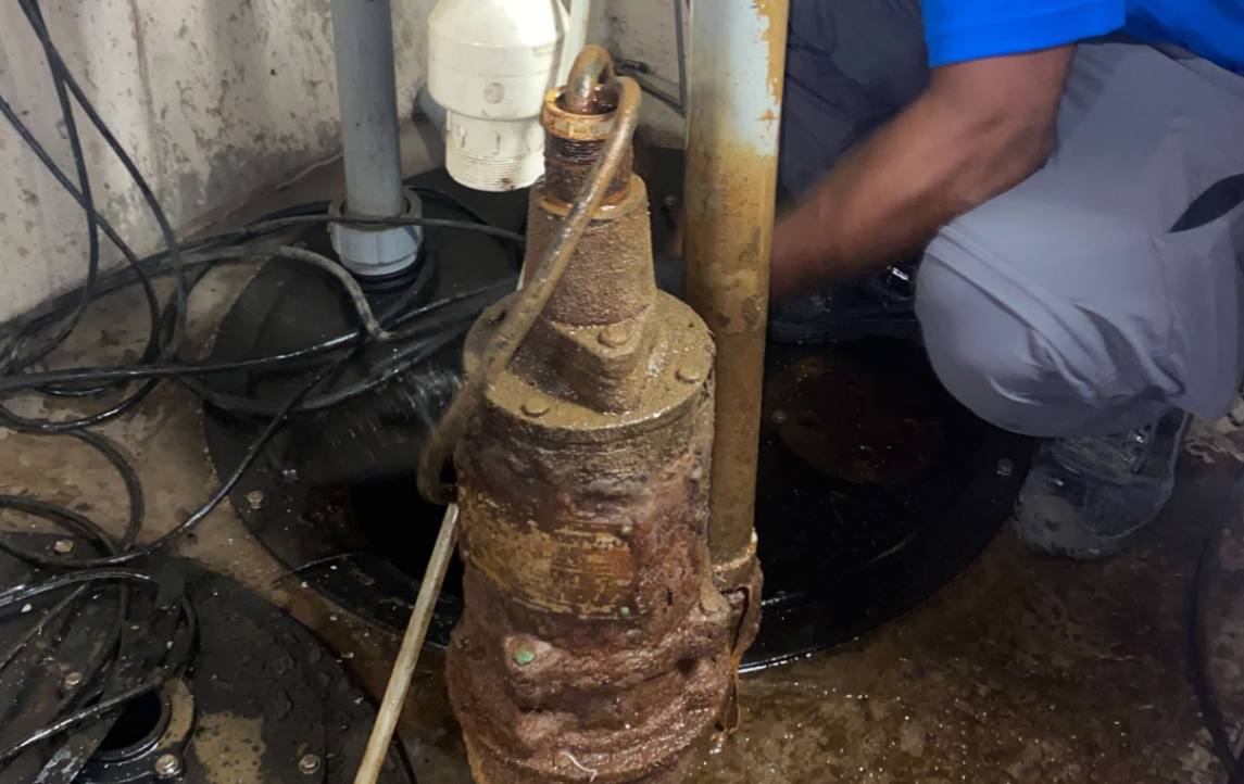 Replacing a rusty submersible unit as part of a sump pump repair local by Superior Plumbing & Heating.