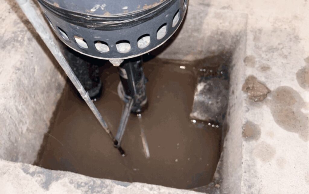 Troubleshooting a flooded sump pit during a sump pump repair local by Superior Plumbing & Heating.
