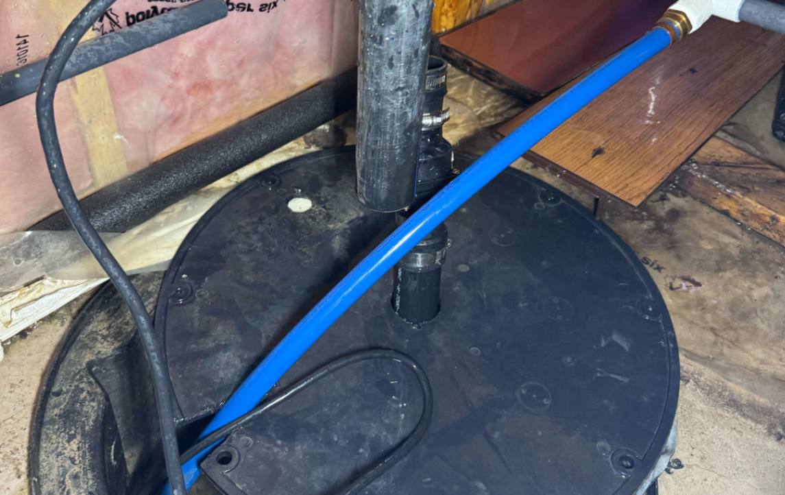 Superior Plumbing & Heating discharge line connection for a residential sump pump repair local.
