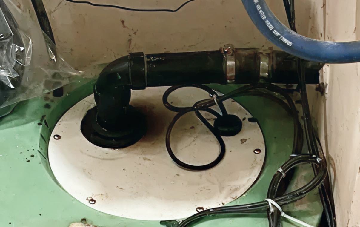 Professional discharge pipe setup after a sump pump repair local by Superior Plumbing & Heating.