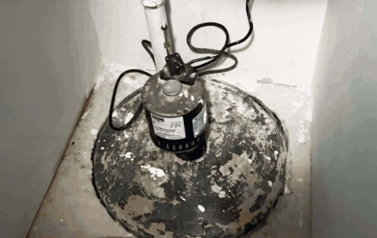 Alt: Old pump unit on a sealed lid needing sump pump repair local by Superior Plumbing & Heating.