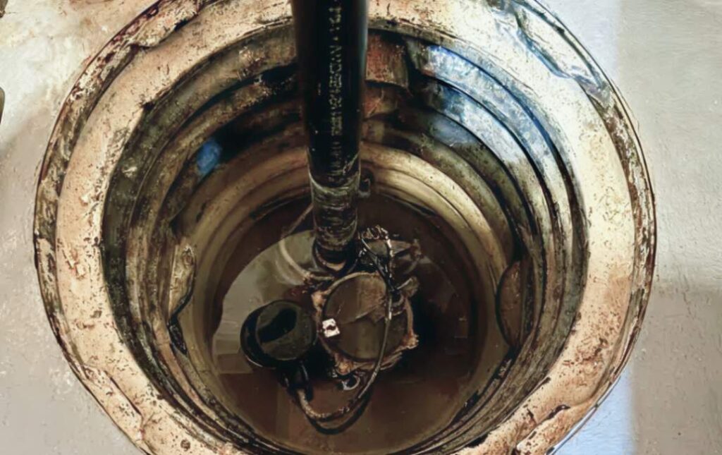 Circular pit diagnostics and cleaning for sump pump repair local by Superior Plumbing & Heating.