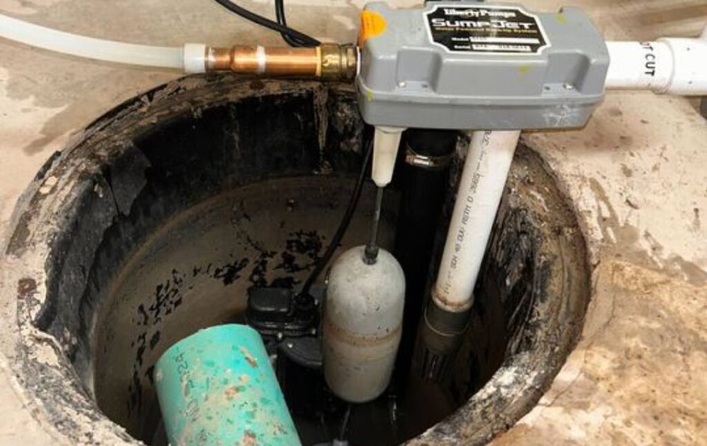 High-tech backup system installation during a sump pump repair local by Superior Plumbing & Heating.