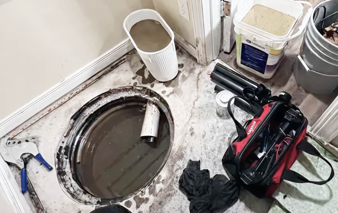 Professional tool setup in a basement for a sump pump repair local performed by Superior Plumbing & Heating.