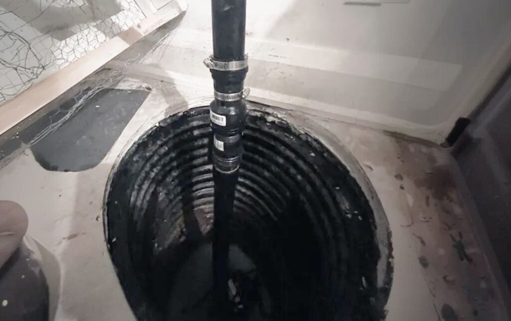 Detailed corrugated pit wall inspection during sump pump repair local by Superior Plumbing & Heating.