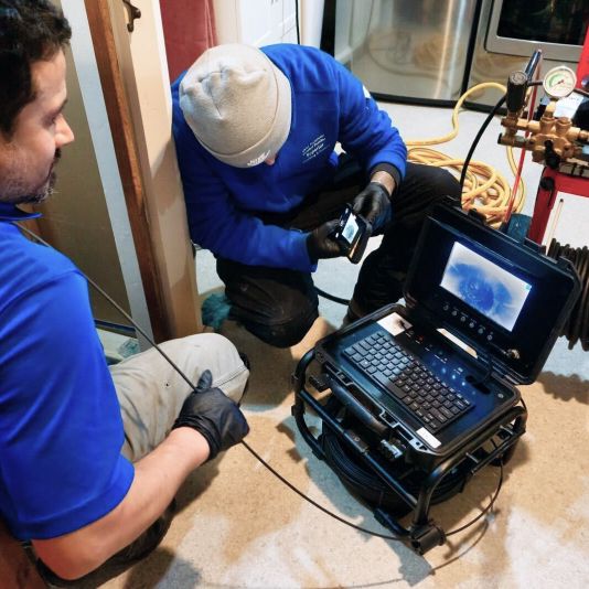 A plumber inspects your lines