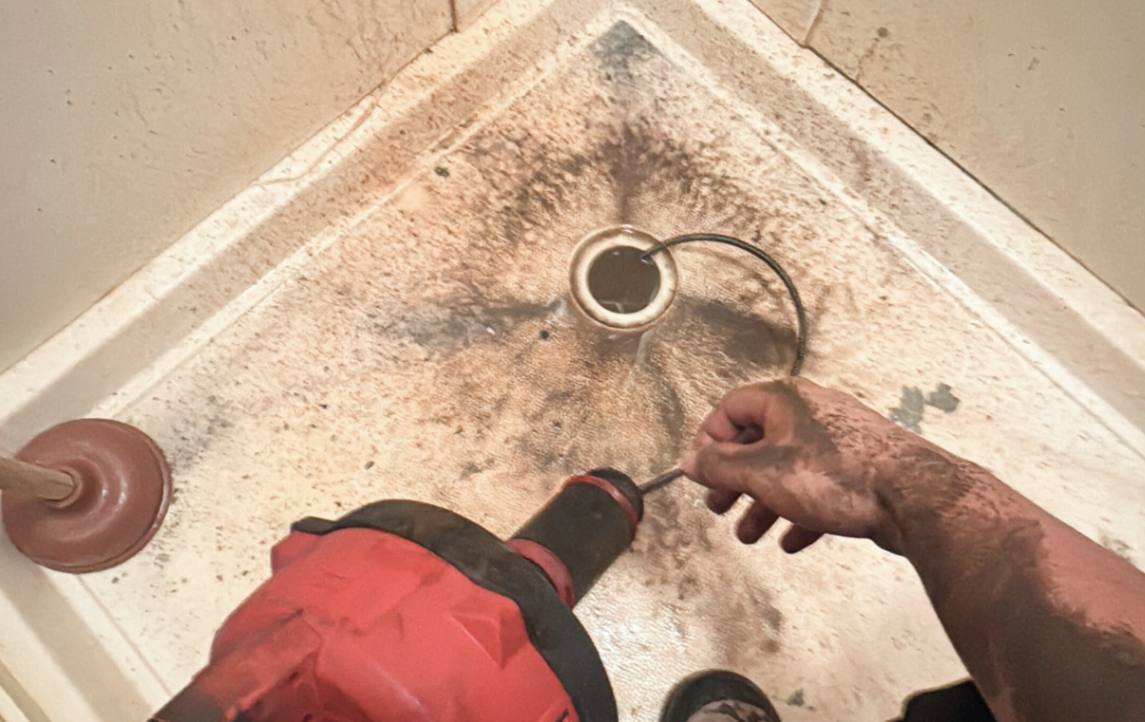 Emergency plumbing repair for blocked shower drain